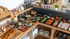 A buffet with various food items and condiments. - Willa Folk & Prestige (Zakopane)