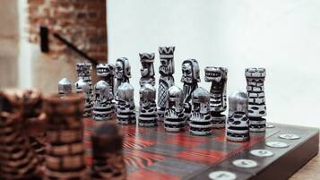 A chessboard with unique, intricately designed pieces.