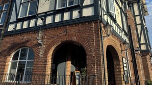 A traditional building with a sign reading "Shendans Bar Restaurant & Hotel." - Sheridans (Wallasey)