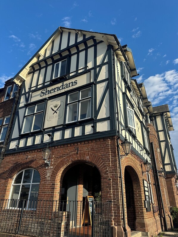 A traditional building with a sign reading "Shendans Bar Restaurant & Hotel."