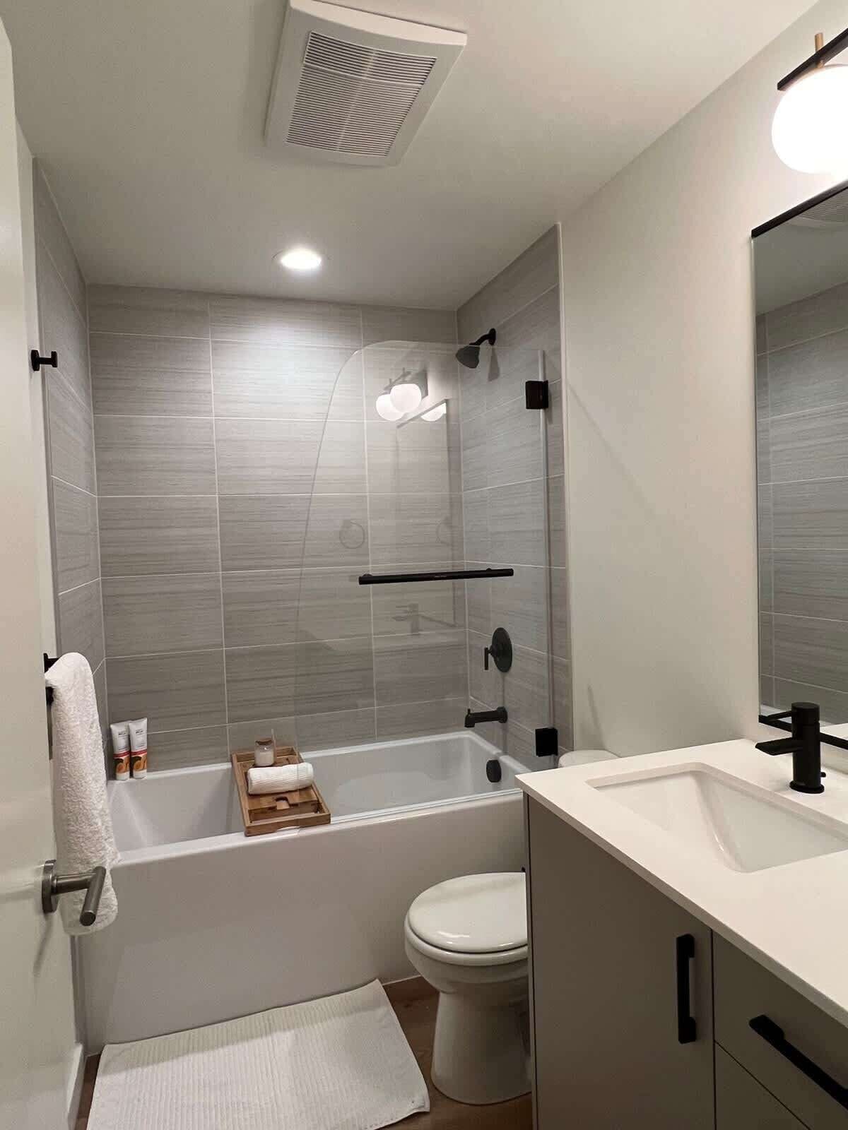 Shower, hair dryer, towels, shampoo
