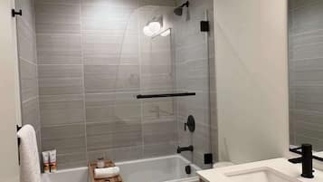 Shower, hair dryer, towels, shampoo
