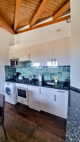 Apartment, 2 Bedrooms | Private kitchen | Full-size fridge, microwave, stovetop, toaster