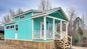 A turquoise wooden cabin with a porch, a staircase, and a deck. - Vilonia Country Cabin w/ Grill, Fire Pit + More! (Vilonia)