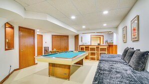 A pool table in a room with a sofa and a desk. - Sauna, Pickleball Court & Game Room: Sultan Villa! (Sultan)