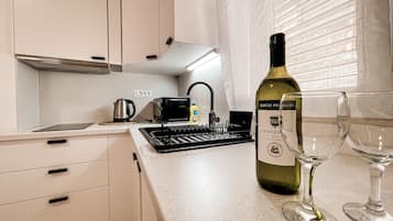 Superior Studio | Private kitchen | Full-sized fridge, microwave, stovetop, electric kettle