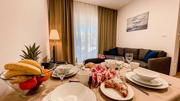 Superior Apartment | Living area | 43-inch LCD TV with satellite channels