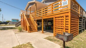 A wooden structure with a ramp and a sign for Kitty Hawk Rentals. - House with No Name - Nags Head MP 10.5, Oceanside, 340 Yds to Beach, Pets OK, YR Flex Stays (Nags Head)