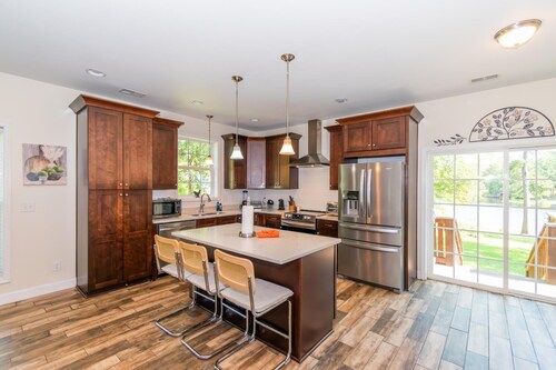 Lakeside Villa Retreat 5-Bedroom Oasis with 6 TVs, 3-Acres of Waterfront, Fishing & Canoe Adventures!