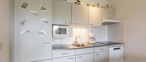 Dishwasher, coffee/tea maker, toaster, dining tables