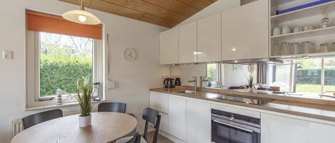 Dishwasher, coffee/tea maker, toaster, dining tables