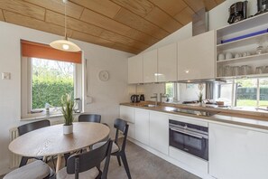 Dishwasher, coffee/tea maker, toaster, dining tables