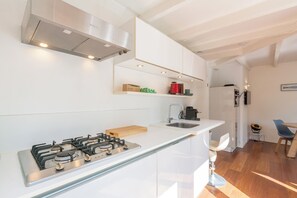 Dishwasher, coffee/tea maker, toaster, dining tables