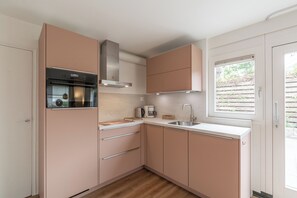 Coffee/tea maker, toaster, high chair, dining tables