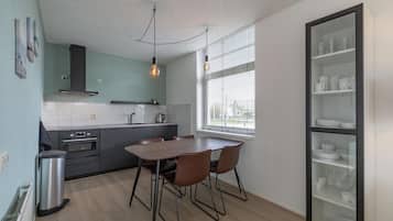 Dishwasher, coffee/tea maker, toaster, dining tables