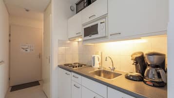 Dishwasher, coffee/tea maker, toaster, dining tables