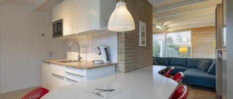 Dishwasher, coffee/tea maker, toaster, dining tables