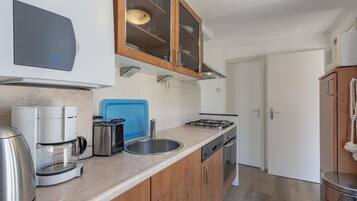 Fridge, dishwasher, coffee/tea maker, dining tables