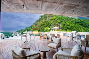 Rooftop amenities include an infinity pool, jacuzzi, snarck bar, BBQ and multiple cabanas - Two Pools, Bar & Gym | Casa Medianoche at Oasis (Puerto Vallarta)