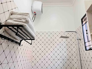 Shower, hair dryer, towels, soap