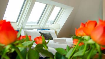 Deluxe Apartment, 1 Bedroom, Balcony | Living area | 40-inch Smart TV with cable channels, heated floors