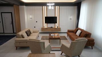 Deluxe Villa | Living room | Flat-screen TV, heated floors