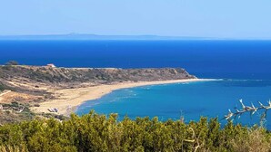 A coastal landscape with a beach, cliffs, and a clear view of the sea. - Mounda Beach Villa - Four Bedroom Villa, Sleeps 7 (Ionian Islands)