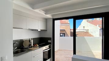 Fridge, oven, coffee/tea maker, cookware/dishes/utensils