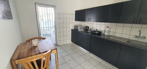 Fridge, microwave, electric kettle, cookware/dishes/utensils