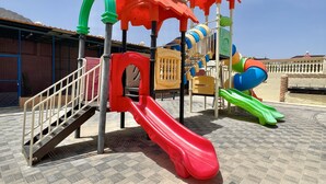 A playground with multiple slides and climbing structures. - Cloud Cloud Farm Resort (Izki)
