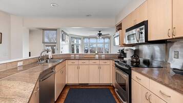 Fridge, microwave, coffee/tea maker, cookware/dishes/utensils