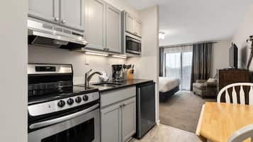 Fridge, microwave, coffee/tea maker, cookware/dishes/utensils