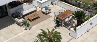 Luxurious apartment with large sunny terrace within walking distance to the sea and stores.