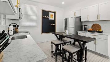 Coffee/tea maker, fridge, microwave, oven