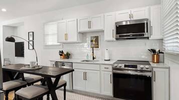 Coffee/tea maker, fridge, microwave, oven