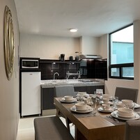 Deluxe Apartment, 2 Bedrooms, Terrace | Private kitchen | Full-size fridge, microwave, oven, electric kettle