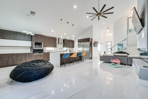 Enjoy cooking and dining in this well-equipped kitchen with a central island and bar stools.