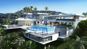 A modern multi-story house with a large swimming pool, outdoor seating, and lush greenery. - Madrid (Madrid)