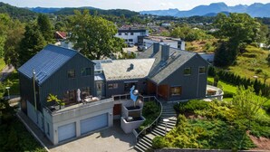 A modern house with a garage, a staircase, and a view of the surrounding landscape. - Pet friendly home in ålesund (Ålesund)