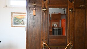 A wooden door with a metal handle and a small orange ornament. - S327 - Sirolo, comfortable two-room apartment well equipped (Sirolo)