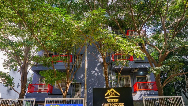 A building with balconies, a sign for 'Tab Hotels', and another sign for 'Grey-House'. - Fabhotel Grey Inn (Pune)