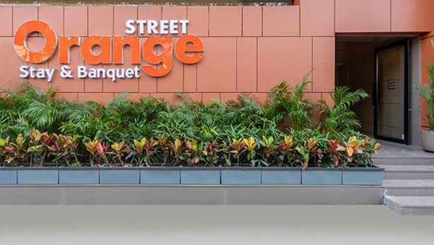 A hotel sign with the name 'Orange Stay & Banquet'. - FabHotel Orange Oasis (Bhopal)