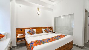 Deluxe Room | Egyptian cotton sheets, premium bedding, in-room safe, soundproofing - Fabhotel Montreal (Rishikesh)
