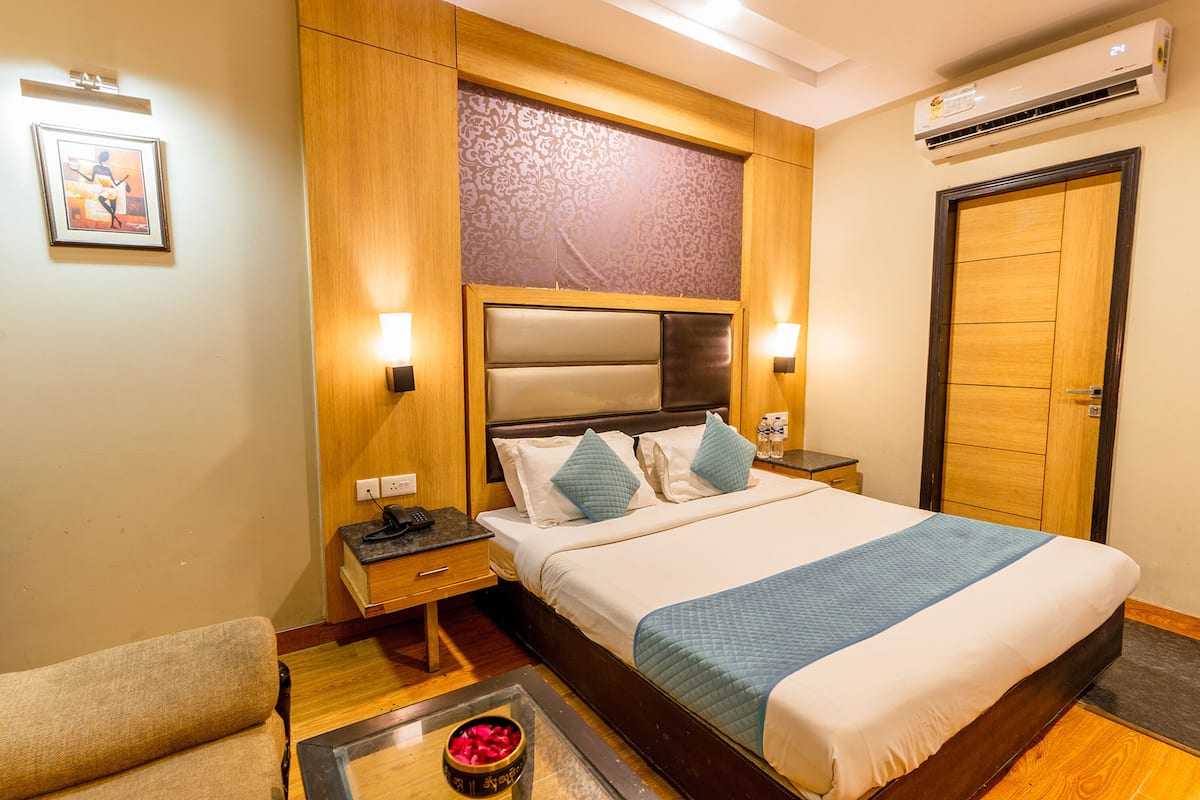 Deluxe kamer | Lakens van Egyptisch katoen, luxe beddengoed, een kluis op de kamer