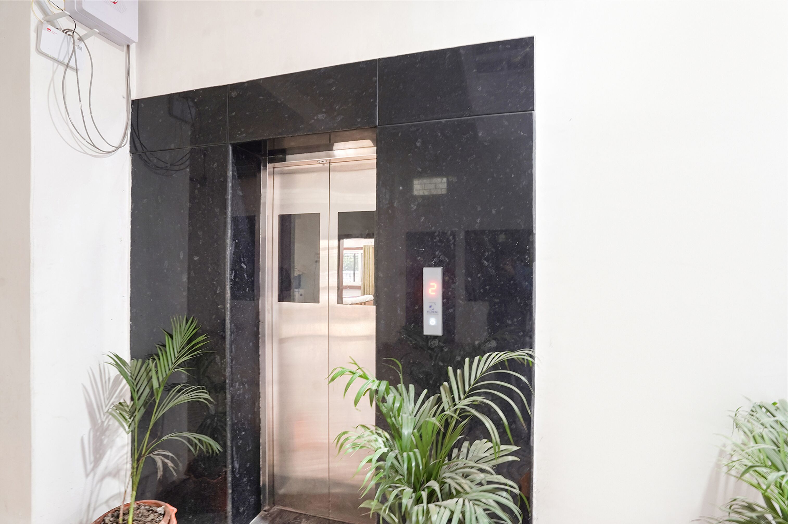 An elevator with a digital display showing the number 2.