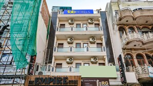 A multi-story building with a sign for 'Tab Hotels' on the top. - Fabhotel East Patel Nagar (New Delhi)