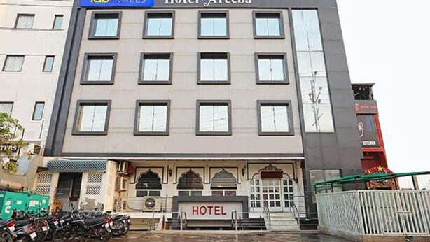 A multi-story hotel with a sign reading "Hotel Areeba" and "fab hotels" above the entrance. - Fabhotel Taj Castle (Agra)