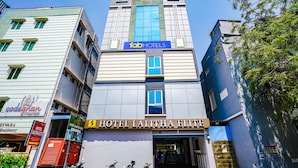 A hotel with a prominent sign reading "HOTEL LALITHA ELITE." - Fabhotel Lalitha Elite (Vijayawada)