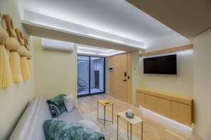 Comfort Apartment, Balcony, Ground Floor | Living area | 40-inch Smart TV with cable channels, Netflix, streaming services