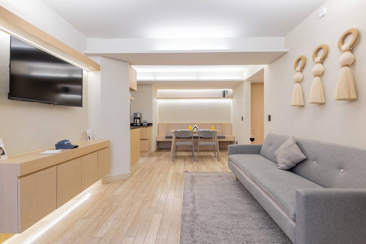 Comfort Apartment, Balcony, Ground Floor | Living area | 40-inch Smart TV with cable channels, Netflix, streaming services